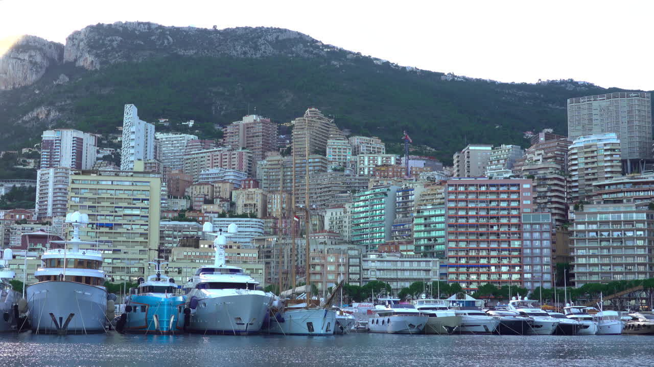 La Condamine, Monaco - July 4, 2025: View of the Monaco skyline from the Port Hercule with docked boats
