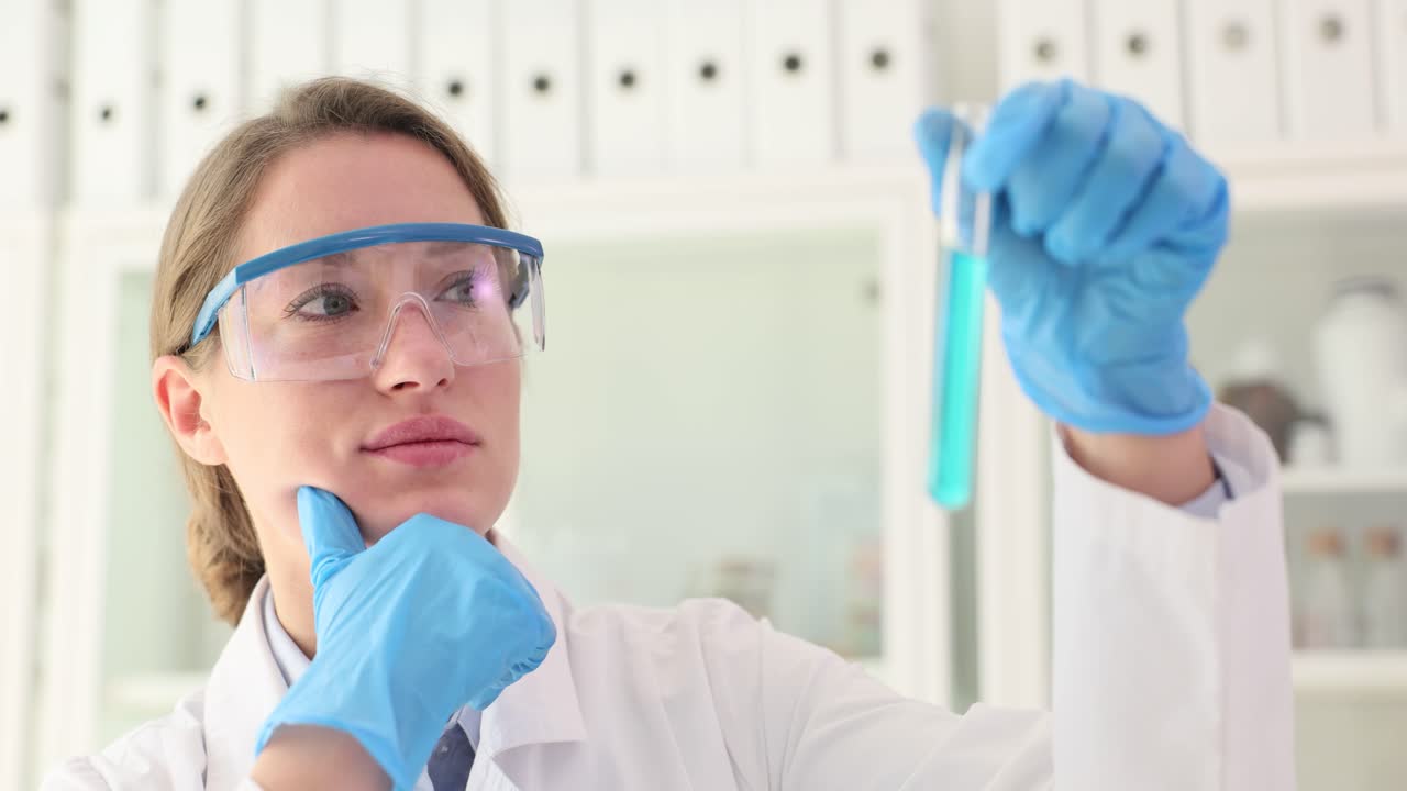 Scientist analyzing a test tube in a laboratory
