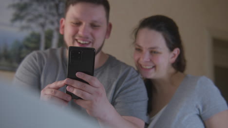 couple having a video call on their smartphone