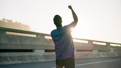 black man, fitness and fist pump with sunset