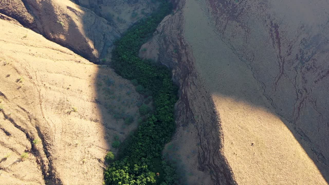 drone shot flying over canyon