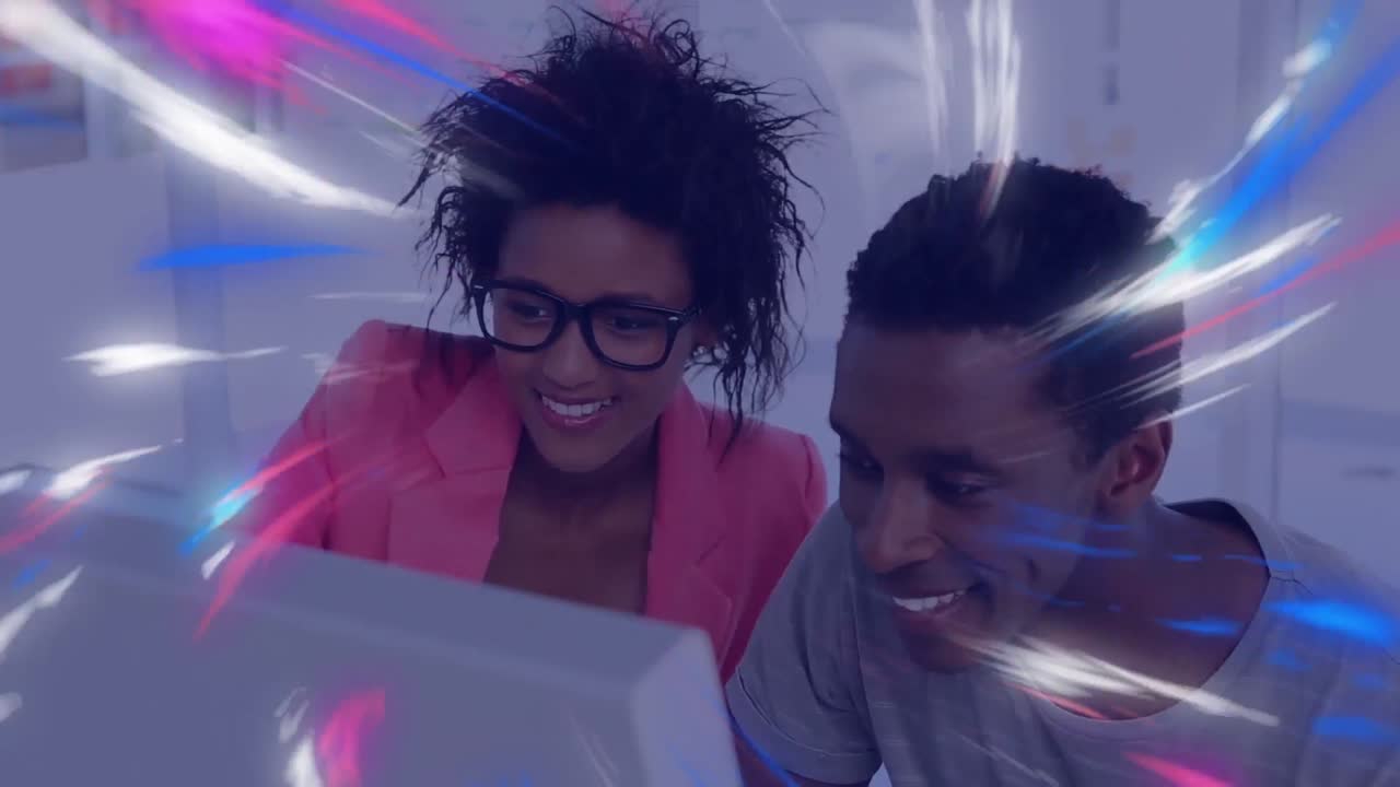 Animation of digital waves over african american male and female colleagues using computer at office