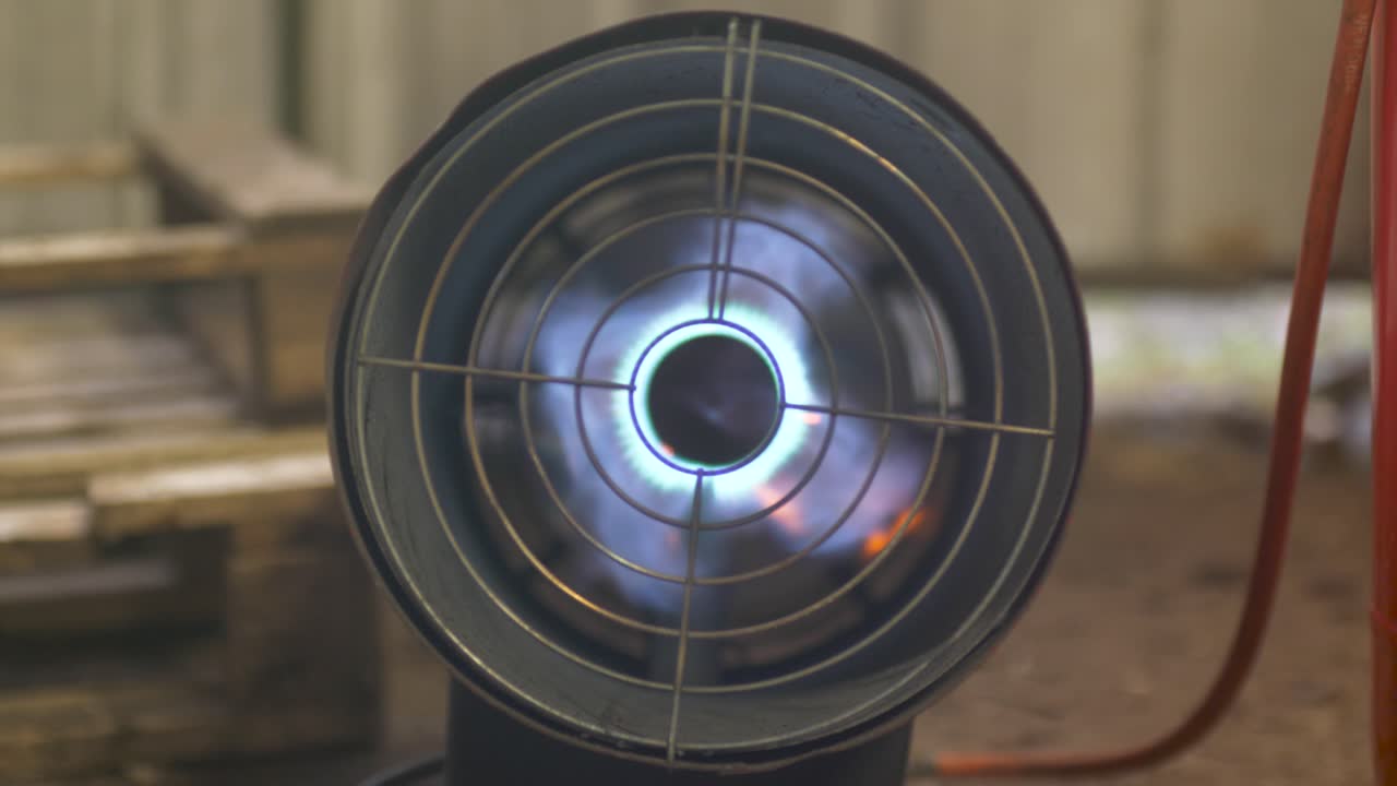 Igniting gas space heater in workshop