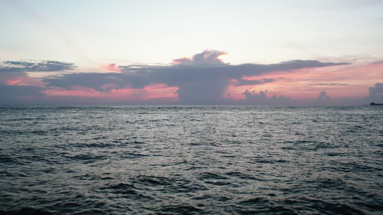 Beautiful Florida sunset in Sarasota. Forward moving shot above water. 60 fps