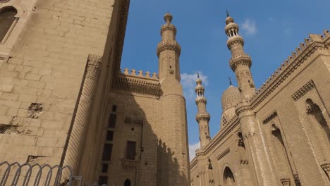 low angle view of majestic mosque-madrasa of sultan hassan building and minarets. cairo