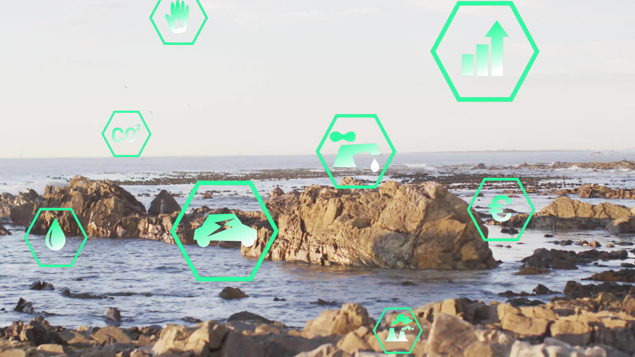 Environmental icons and data processing animation over rocky coastal landscape