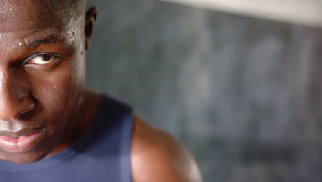 sweating and focused, african american man, athletic wear during intense workout in gym, copy space