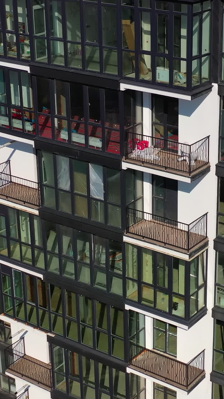 Modern buildings aerial view. Urban cityscapes architecture exterior construction. Vertical video