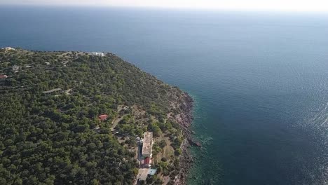 Forward-slow-motion-drone-shot-over-the-island-of-Agia-Marina-in-Aigina,Greece