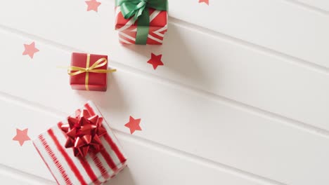 video of christmas gifts with christmas decoration and copy space on white background