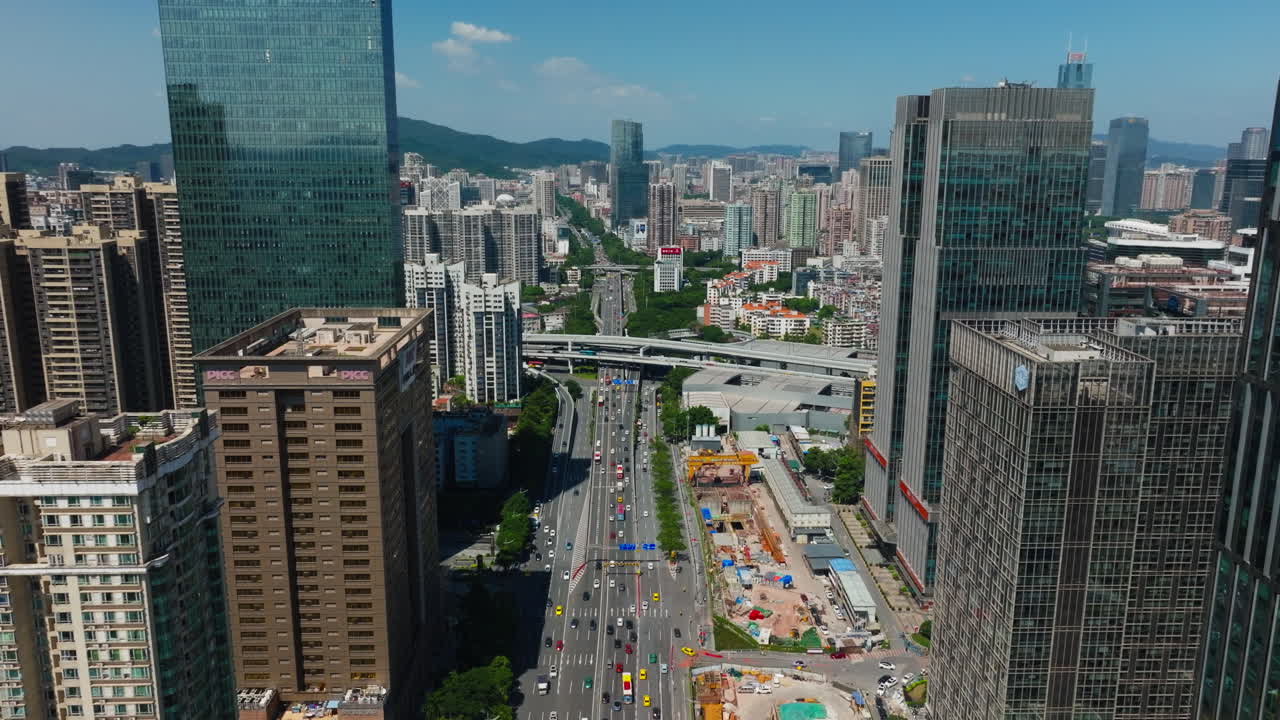 Busy downtown guangzhou, china with high-rise buildings and a clear sky, aerial view