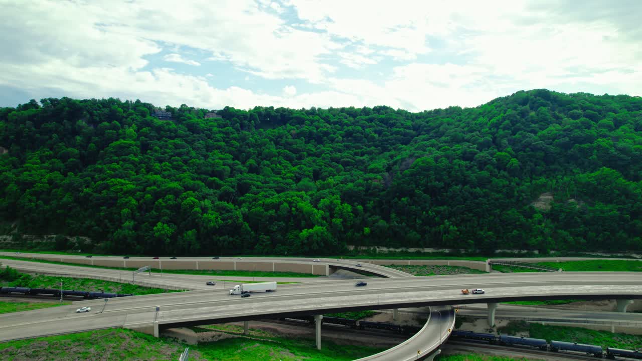 Stinger trailer car hauler driving on interstate overpass, aerial view