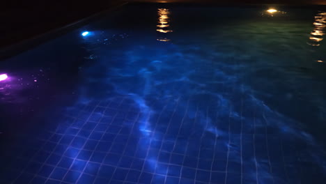 illuminated swimming pool at night