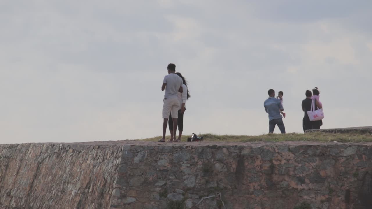 Couples and families enjoying the view in Galle Dutch Fort , Taken from far away distance b roll clip,