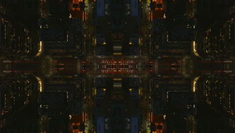 Top-town-shot-of-streets-and-buildings-in-large-city-at-night.-Abstract-computer-effect-digital-composed-footage.