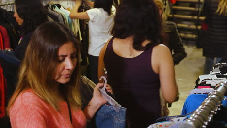 Two Women Shopping for Clothes at a Retail Store