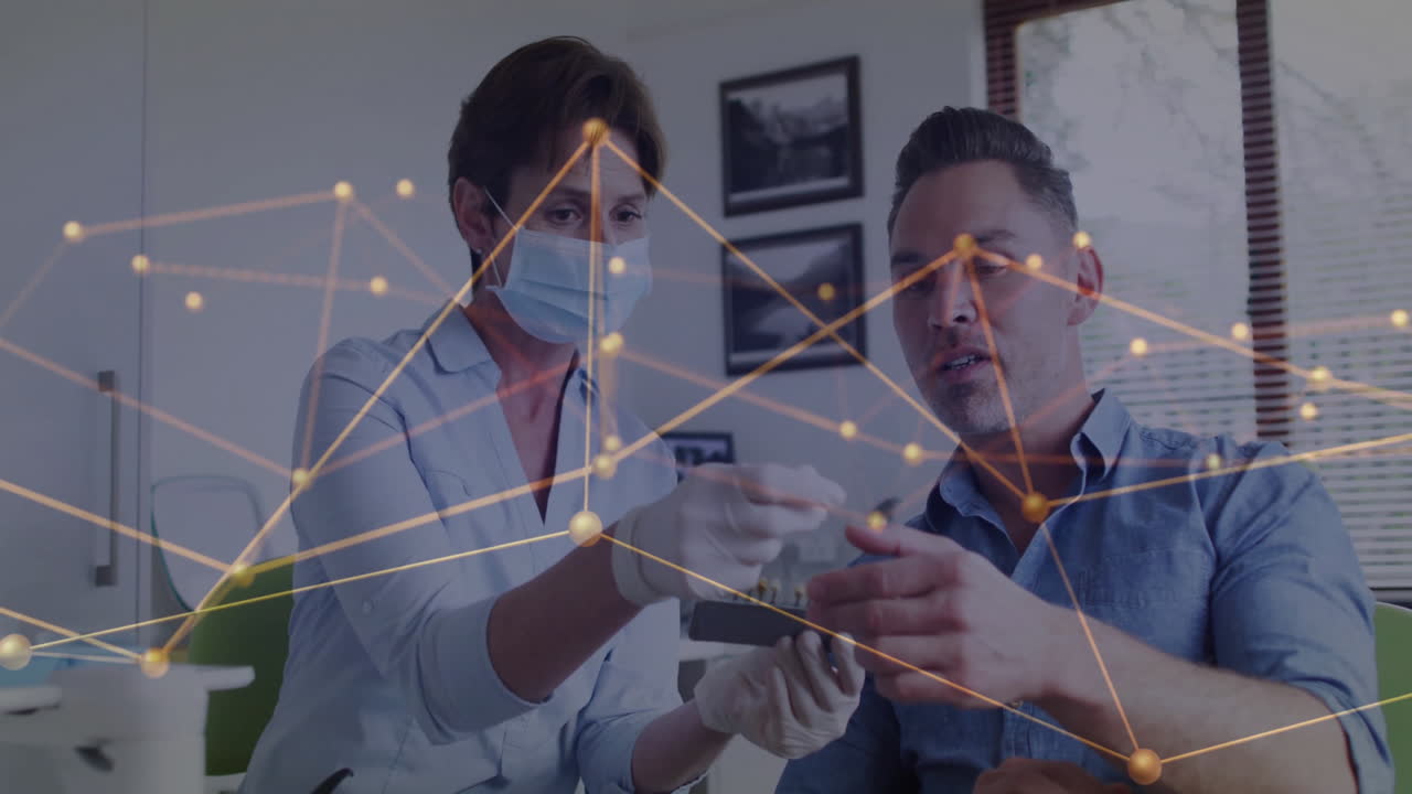 Explaining procedure, healthcare professional with network connections animation overlay to patient