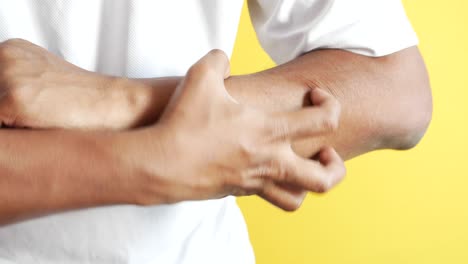 person itching arm