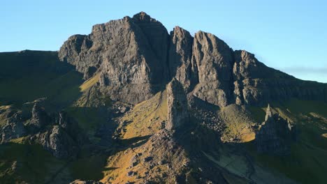 Slow-orbit-towards-ancient-volcanic-plug-The-Old-Man-of-Storr-with-crumbling-landslip-mountain