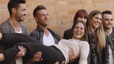 large group of friends having fun outdoors. shot in slow motion