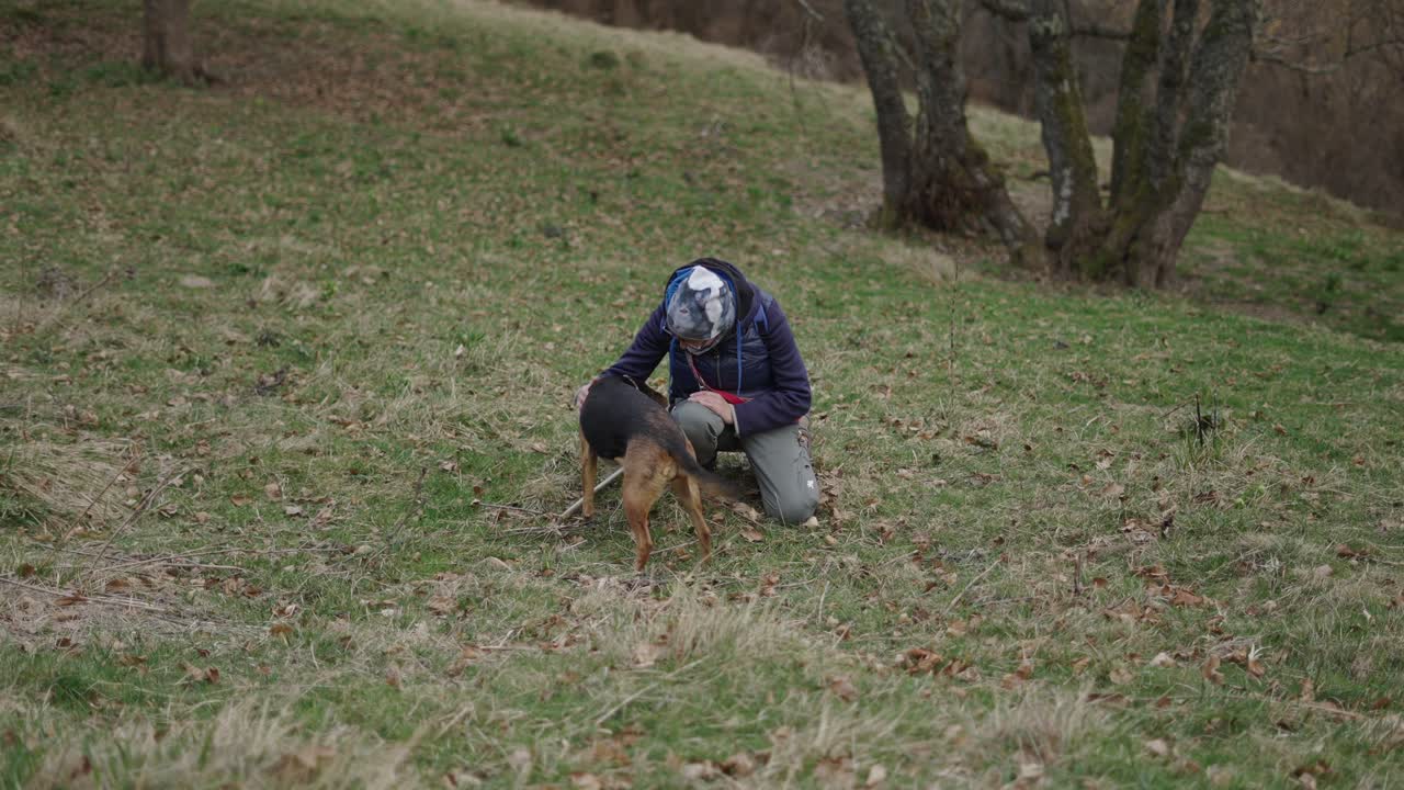 Woman and dog in a field