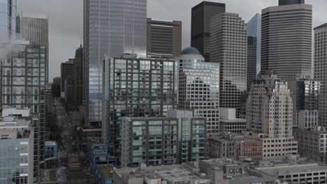 aerial of seattle's many downtown buildings showing the formidable wall of glass that houses so many offices