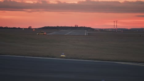 a service vehicle on the landing strip at the vaclav havel airport in prague