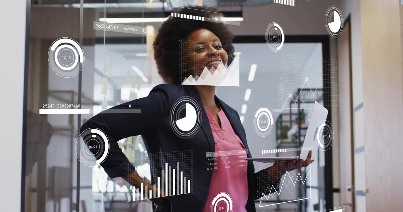 Businesswoman opening laptop typing in office with holographic charts animating for data analysis
