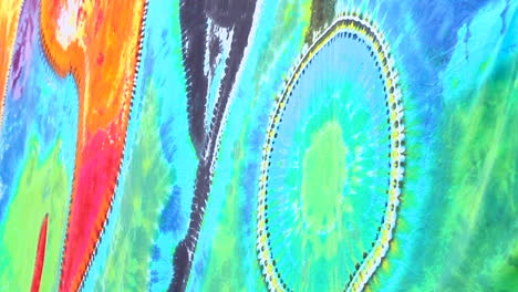 tie dye tapestry blowing in the wind in slo-mo