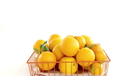 Close-up-of-sweet-limes-in-basket