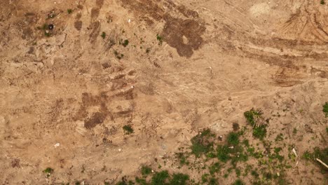 construction site with debris and tire tracks