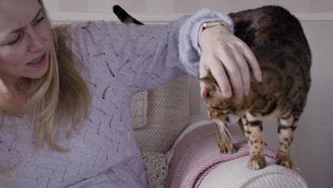 a woman petting her cat