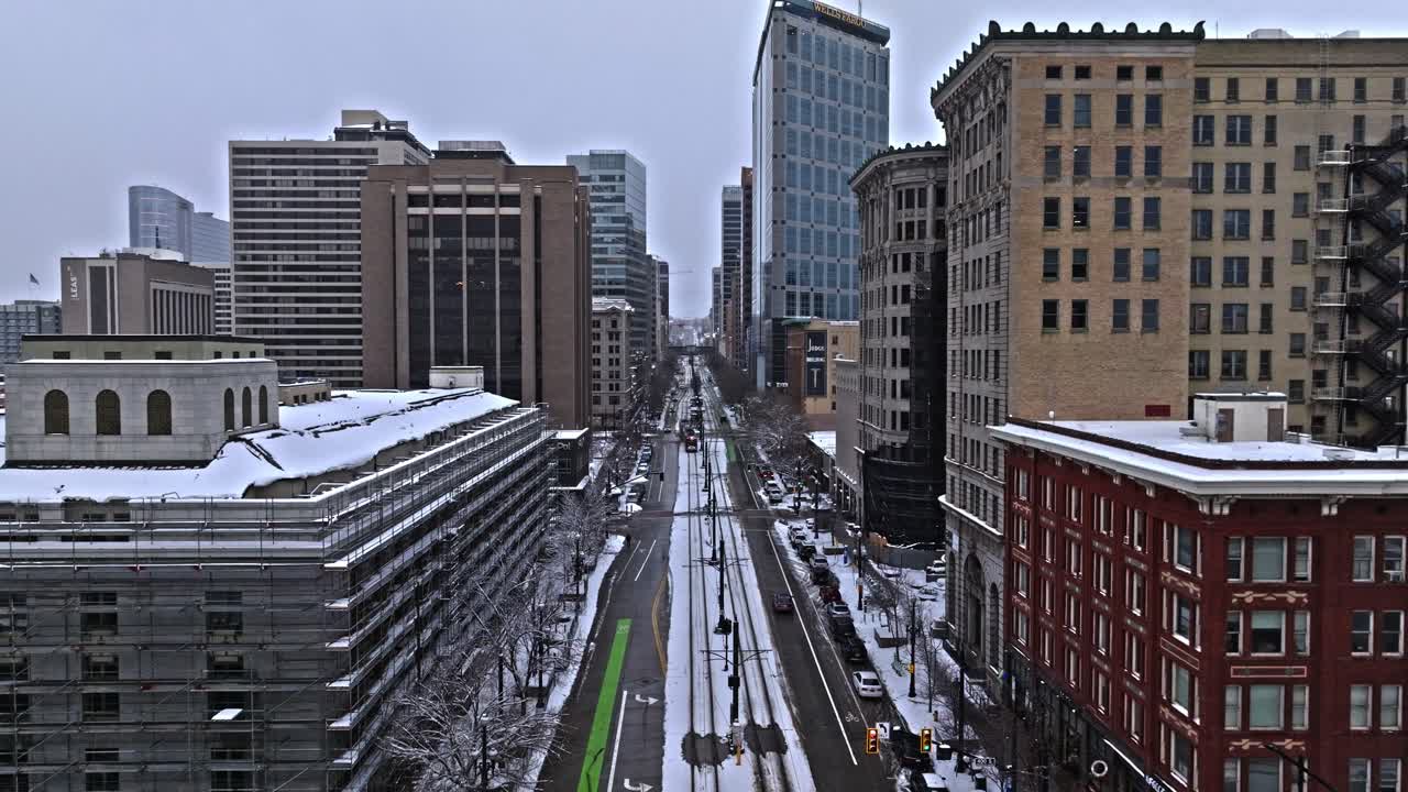 Salt Lake City skyline on winter's day, TRAX light rail system in transit