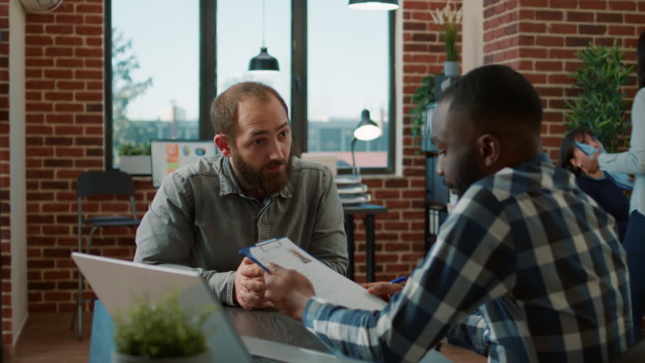 Diverse group of men attending job interview to discuss hiring