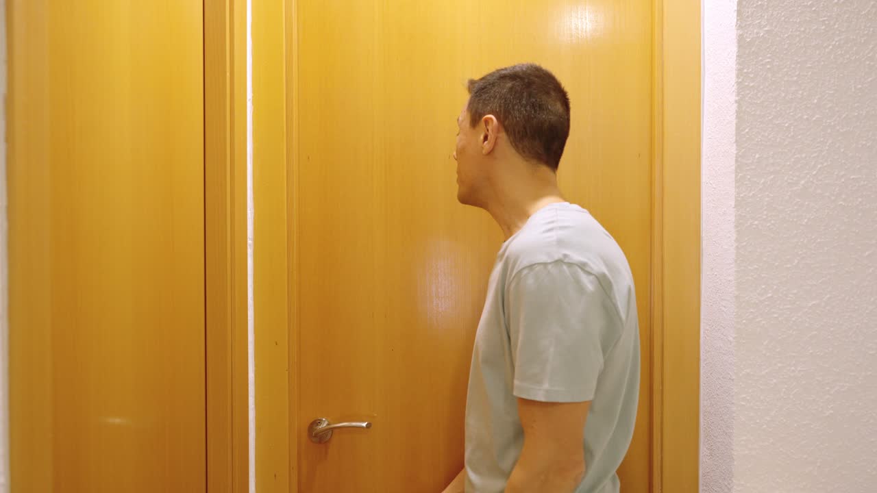 Impatient man waiting for the toilet to become available