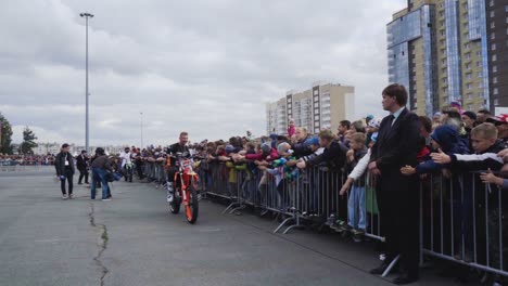 motocross rider performing for crowd