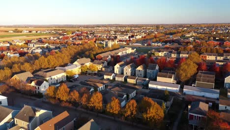 colorful fall neighborhood suburbs church sunset drone shot 4k