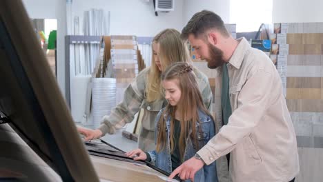 family choosing flooring in a store