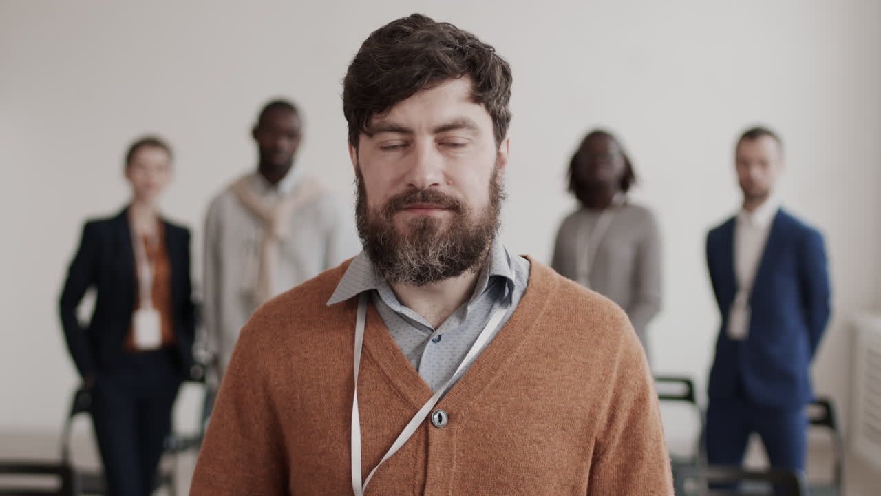 Caucasian Office Worker Reading Booklet Posing