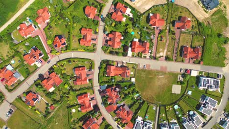 Aerial-view-of-residential-houses-neighborhood-and-apartment-building-complex-at-sunset