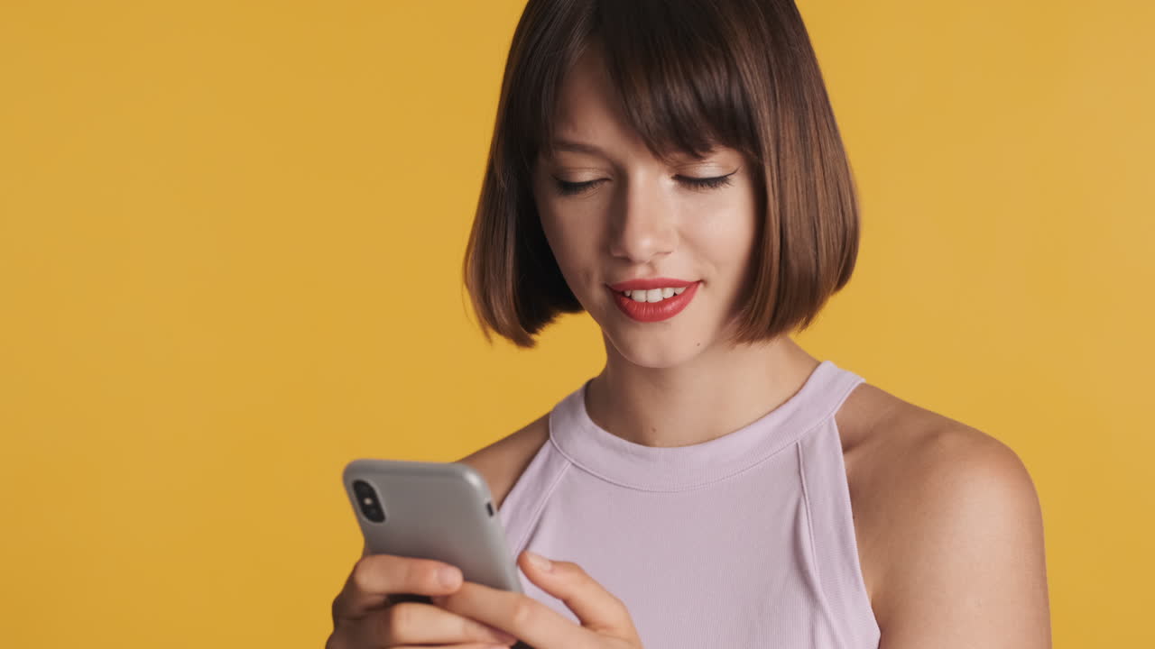Happy woman chatting and biting her red lip