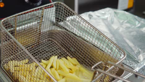 french fries being fried in a commercial fryer