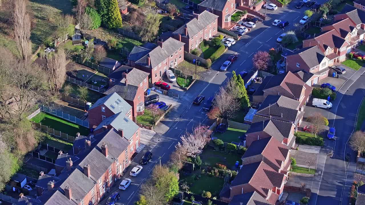Residential houses of the stunning Chesterfield neighborhood in Derbyshire, England, captured from above in soft autumn morning light.