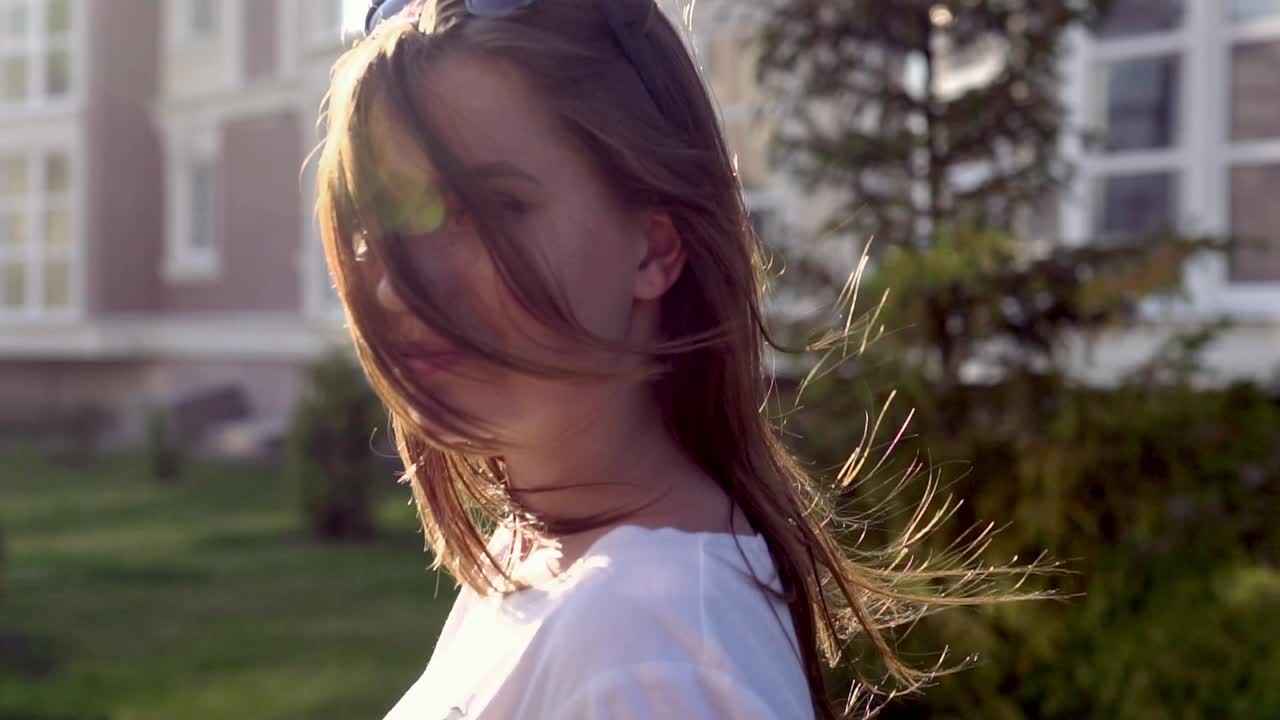 Woman in front and back of building
