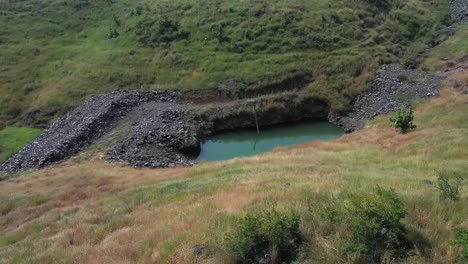 aerial: sustainable forest plantation in a valley with artificial lakes to water the plants in india