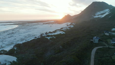 tranquil scenery at betty's bay, cape town at sunset of late winter - aerial ascending