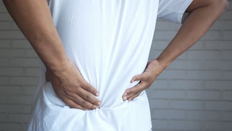 man experiencing back pain