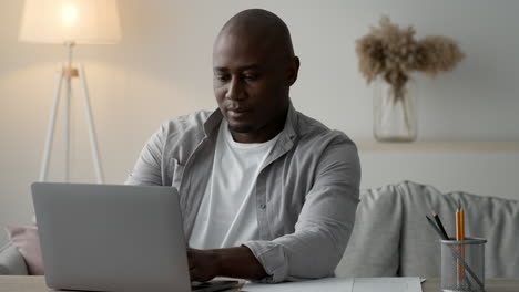 Man working on a laptop at home