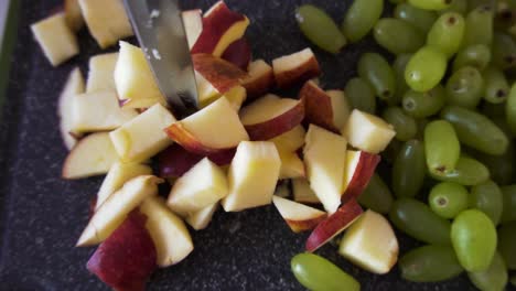 young man making fruit salad