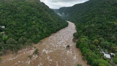 the barron river rushing down the gorge after cyclone jasper in cairns